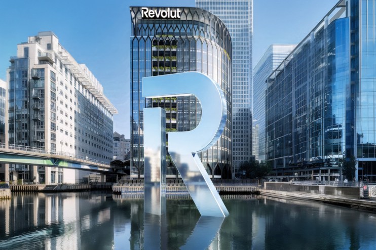 Modern London office building with reflective glass windows under a clear sky, showcasing urban architecture and business ...