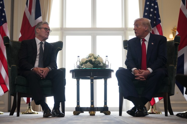 Keir Starmer and Donald Trump engaging in a discussion at a political event, highlighting UK-US relations in 2023.
