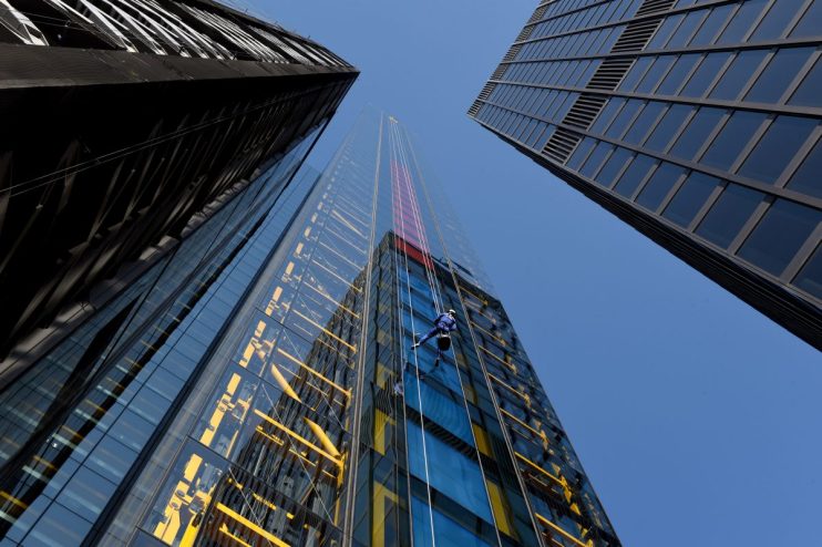 Skyline of Canada with iconic financial district buildings, highlighting UK investments and economic growth.