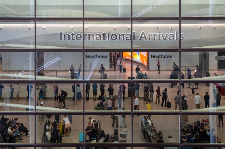 Aerial view of Heathrow Airports bustling terminals with parked airplanes and surrounding infrastructure