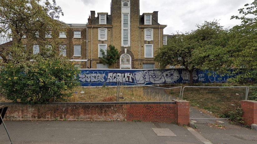 Thorpe Coombe Hospital exterior view from street, showcasing hospital architecture and entrance in urban setting.
