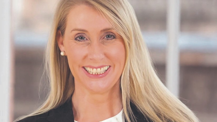 Debbie Crosbie in 2011, business professional attending a corporate event, wearing formal attire, relevant to financial se...