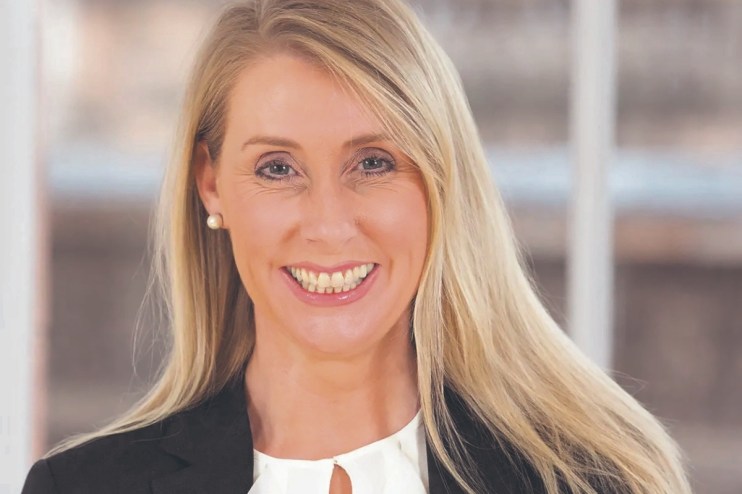 Debbie Crosbie in 2011, business professional attending a corporate event, wearing formal attire, relevant to financial se...