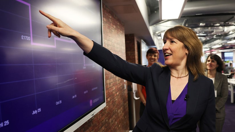 Chancellor Rachel Reeves discussing UK economic strategy at a press conference podium