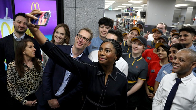 Kemi Badenoch, Conservative leader, visiting a McDonalds restaurant, engaging with staff and patrons, highlighting leaders...
