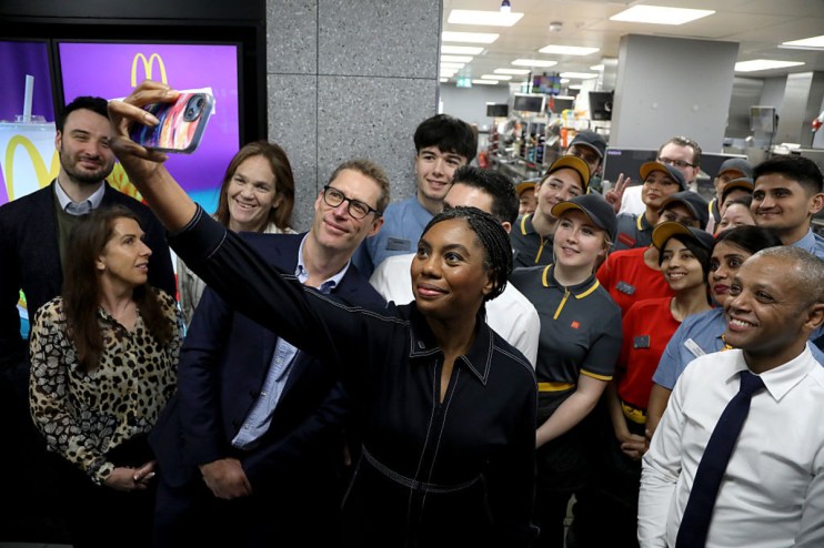 Kemi Badenoch, Conservative leader, visiting a McDonalds restaurant, engaging with staff and patrons, highlighting leaders...
