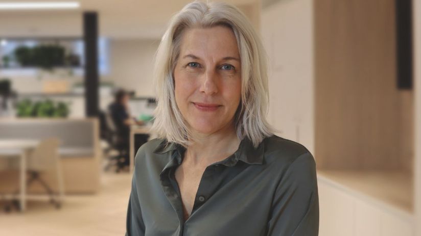 Helen Dickinson in a professional setting discussing business trends and strategies for economic growth on a news website