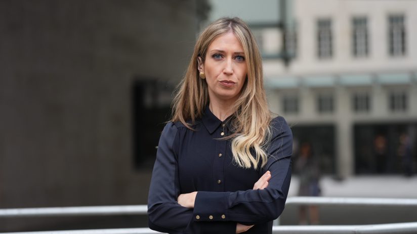 Laura Trott smiling during a public appearance, wearing a professional outfit, reflecting her role in UK politics.