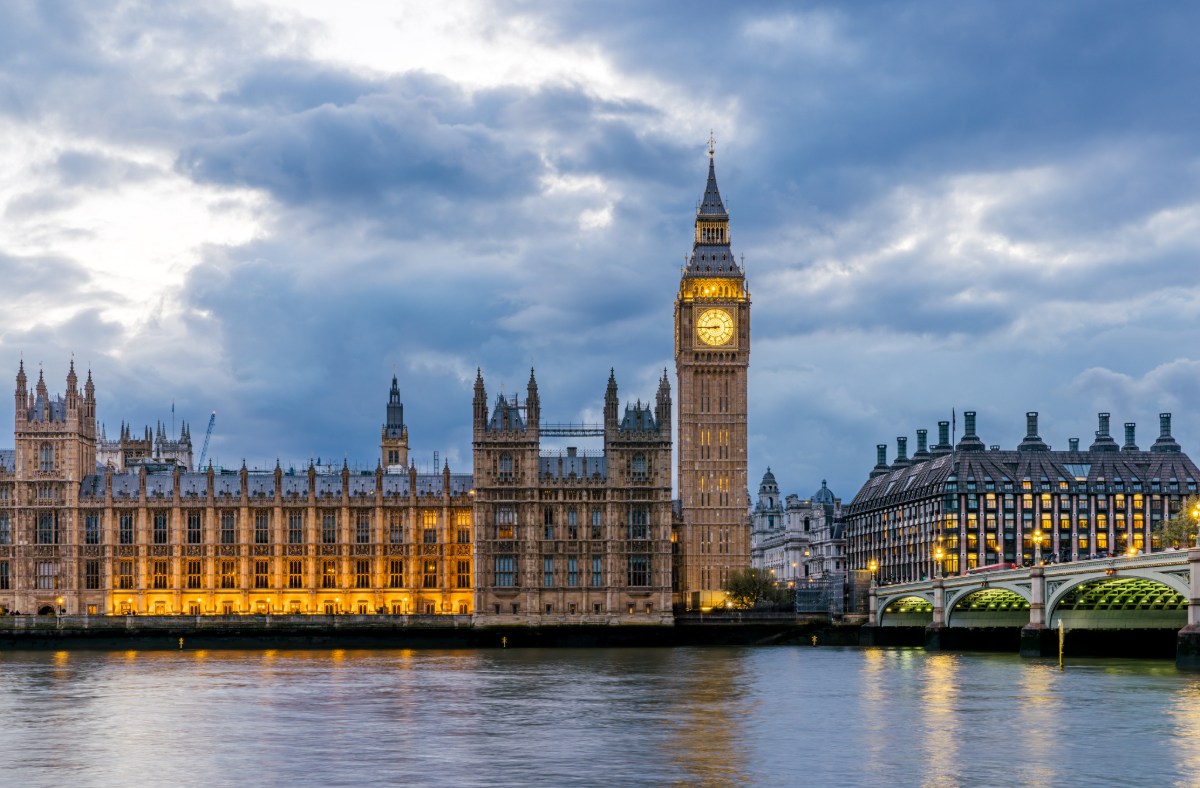 Westminster Parliament building under a clear sky, showcasing its iconic architecture in a news context.