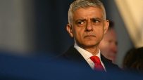 Sadiq Khan addressing media at a press conference in formal attire, discussing recent developments in London policies