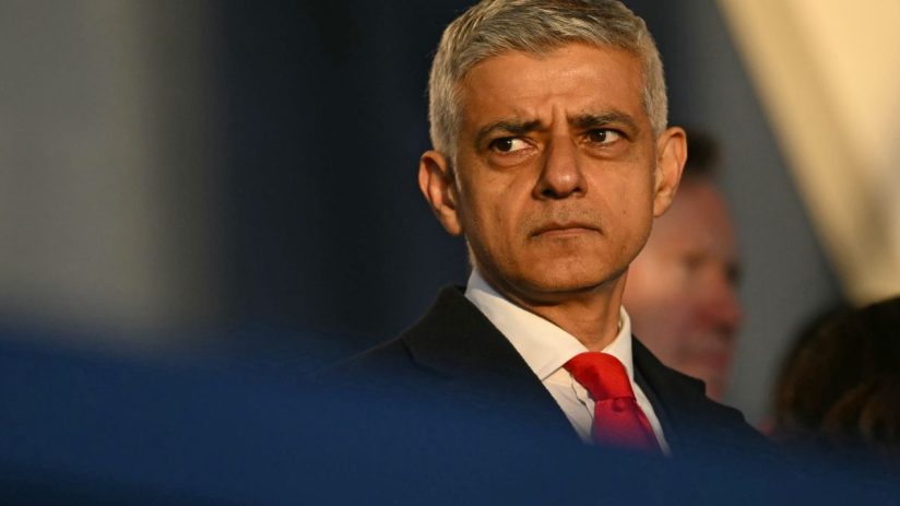 Sadiq Khan addressing media at a press conference in formal attire, discussing recent developments in London policies