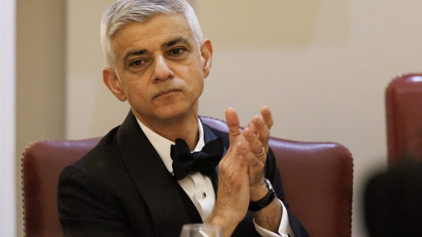 Sadiq Khan speaking at a public event, addressing current issues and engaging with an audience in a formal setting