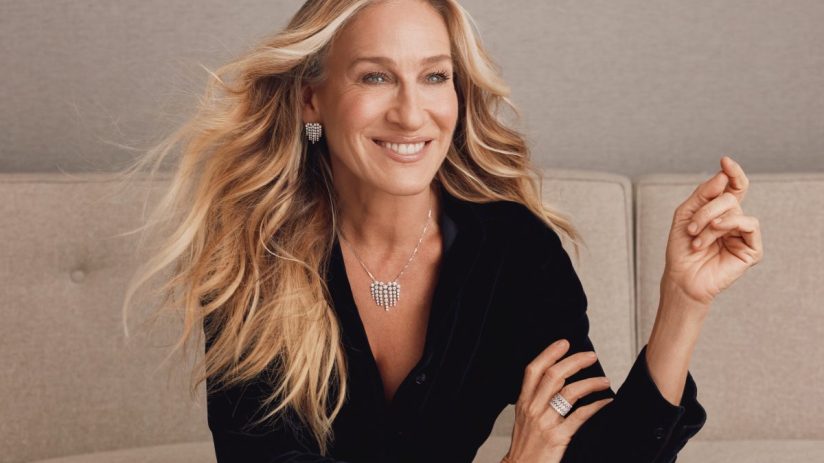 Sarah Jessica Parker at a public event, wearing a stylish outfit, engaging with fans and media in a vibrant city setting