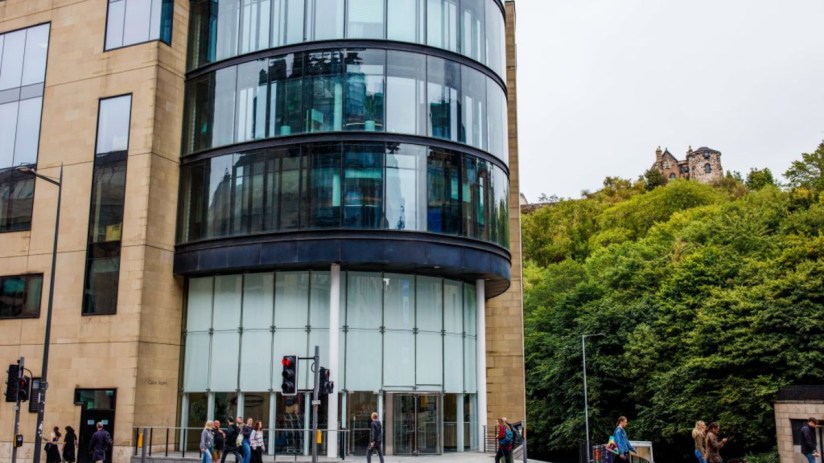 Baillie Giffords Edinburgh headquarters with SpaceX investor branding prominently displayed on the modern office building ...