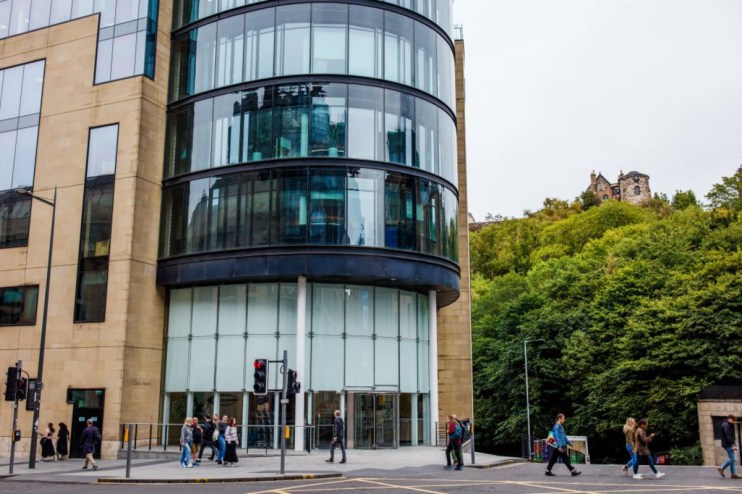 Baillie Giffords Edinburgh headquarters with SpaceX investor branding prominently displayed on the modern office building ...