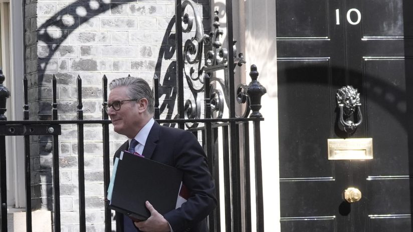 Keir Starmer exiting Number 10 Downing Street after a meeting, showcasing UK political leadership and discussions