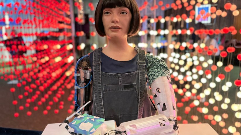 Ai-Da, the humanoid artist robot, showcasing artwork at a gallery exhibition, highlighting AIs creative potential