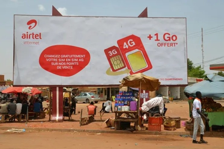 Airtel logo signage on a building exterior indicating the companys presence and branding in a bustling urban area