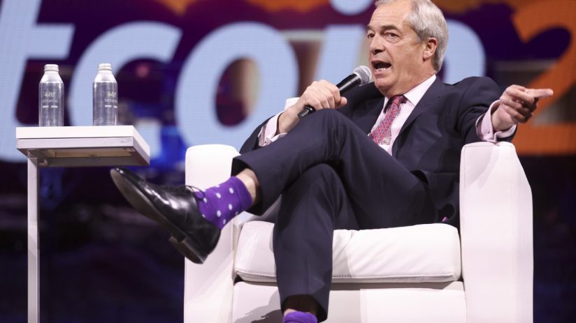 Nigel Farage discussing Bitcoin investment at a business conference, emphasizing cryptocurrencys role in modern finance