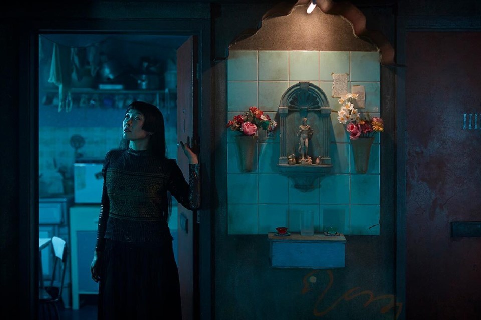 The Burnt City immersive experience by Punchdrunk featuring dramatic, fiery set design and elaborate theatrical costumes.