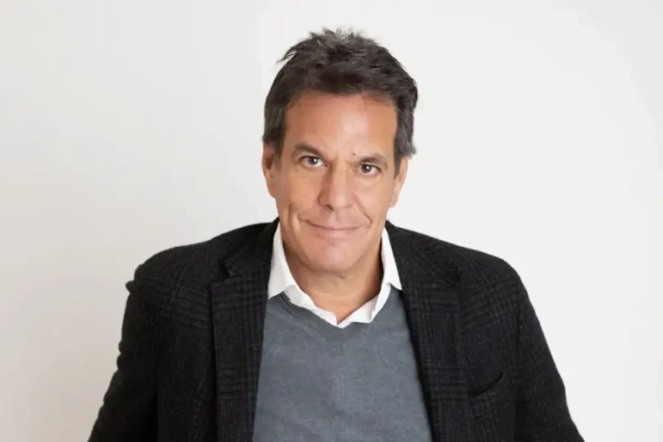 Brent Hoberman speaking at a business conference, addressing industry trends and innovation strategies.