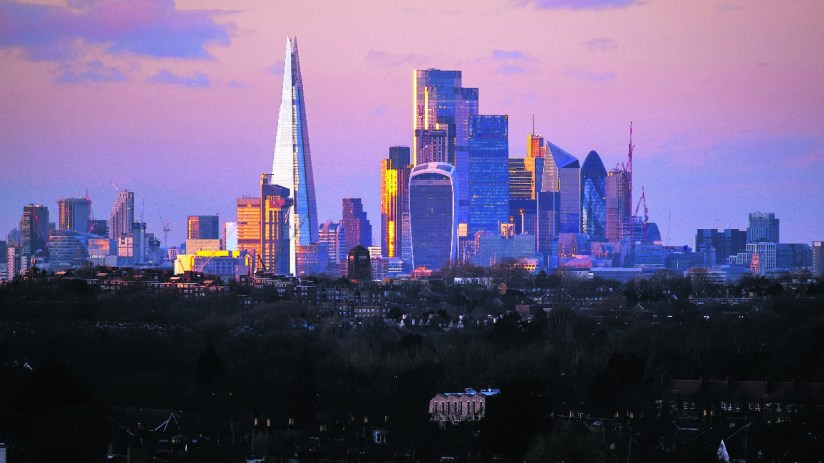 Canada skyline featuring iconic skyscrapers and modern architecture against a clear blue sky