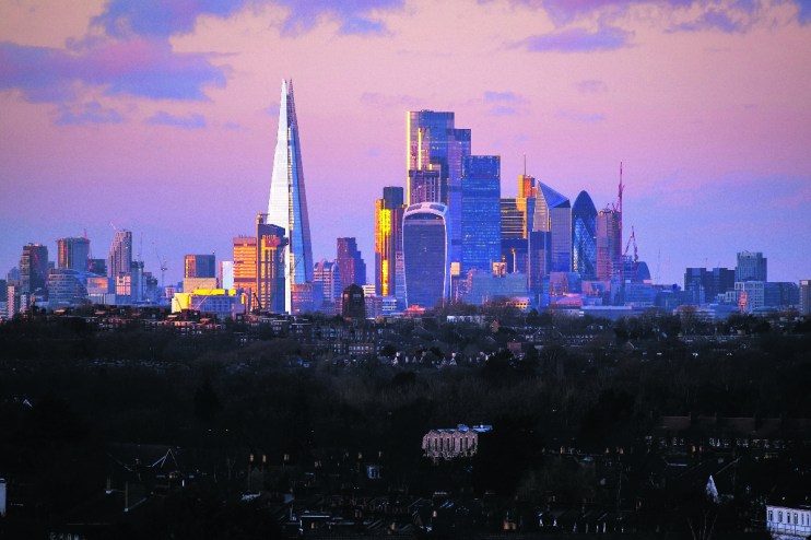 Canada skyline featuring iconic skyscrapers and modern architecture against a clear blue sky