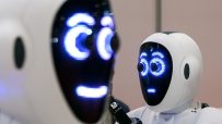 Advanced AI robots collaborating in a tech workspace, showcasing cutting-edge technology innovations in robotics