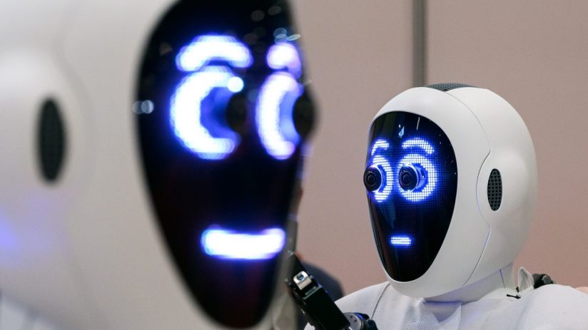 Advanced AI robots collaborating in a tech workspace, showcasing cutting-edge technology innovations in robotics