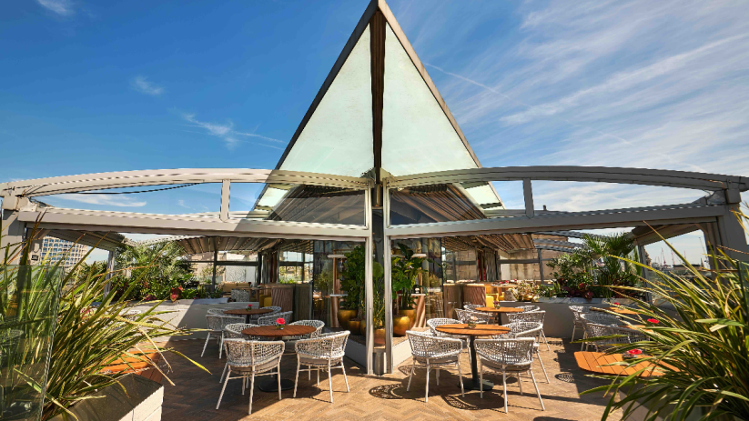 London rooftop bar with scenic views, located in Soho near Covent Garden, featuring stylish seating and vibrant city backdrop