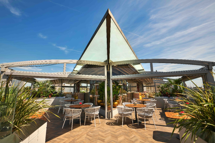 London rooftop bar with scenic views, located in Soho near Covent Garden, featuring stylish seating and vibrant city backdrop