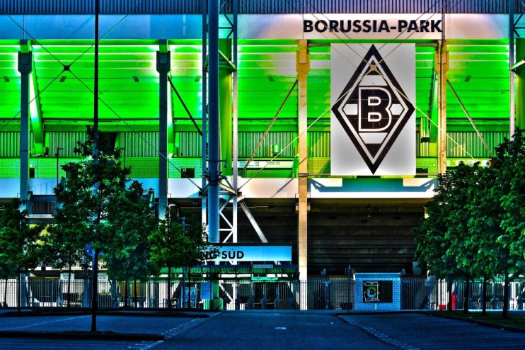 Borussia Park stadium exterior under cloudy sky, home to Bundesligas Borussia M&ouml;nchengladbach, showcasing modern architec...