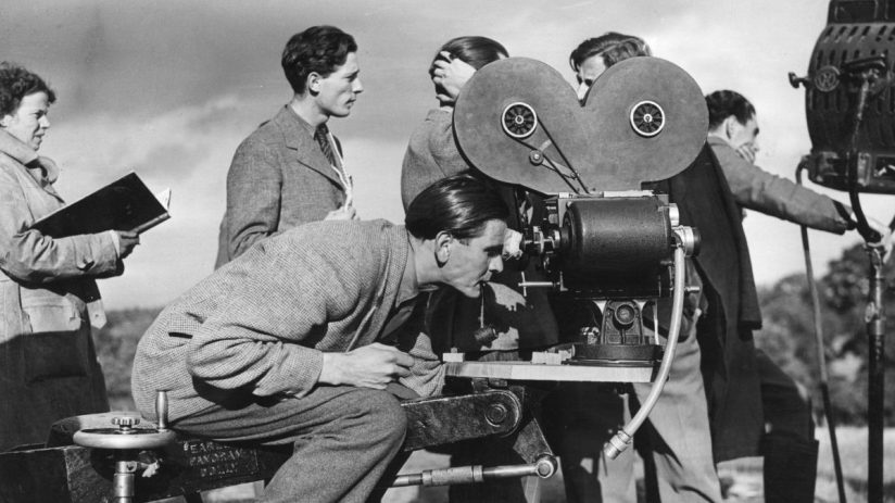 British filmmaking scene with directors and actors collaborating on a movie set, showcasing vibrant UK film industry.