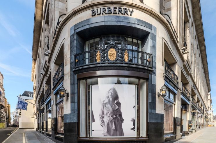 Burberry fashion show runway featuring models in luxury attire showcasing the latest collection in an elegant setting