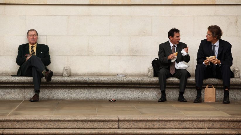 Businessman eating lunch outdoors in Canada financial district