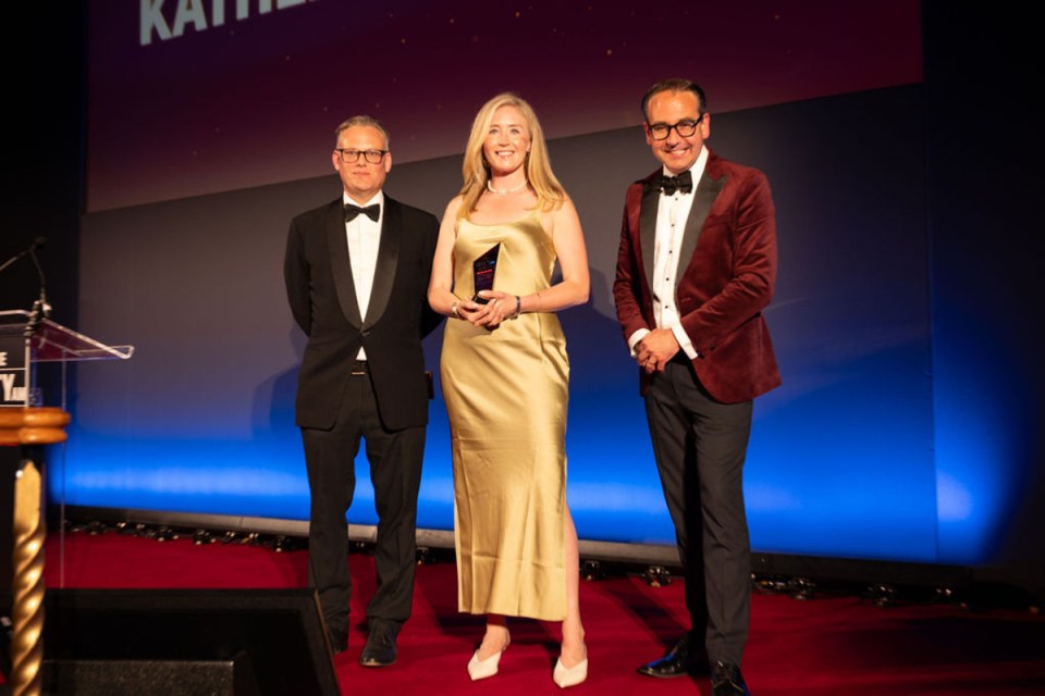 Kathleen Brooks accepting an award at Morning Wire Awards ceremony, celebrating achievements in the business sector.