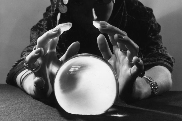 Crystal ball symbolizing prediction markets in a business context, reflecting future forecasting and financial trends.