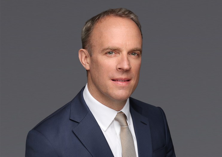 Dominic Raab headshot featuring a professional demeanor, wearing a suit and tie, against a neutral background.