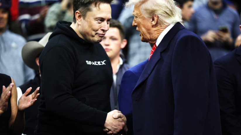 Elon Musk and Donald Trump in conversation at a business summit, both appearing engaged and focused, highlighting leadersh...