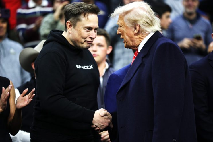 Elon Musk and Donald Trump in conversation at a business summit, both appearing engaged and focused, highlighting leadersh...