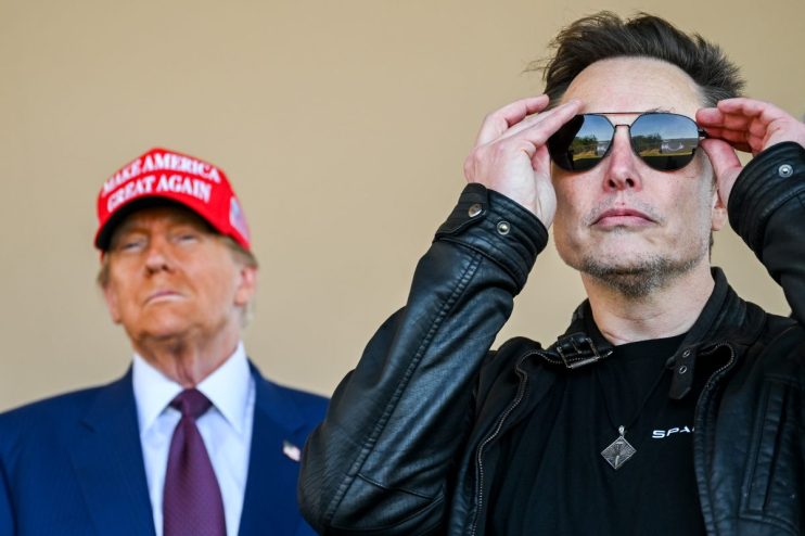 Elon Musk discussing SpaceX innovations with former President Trump against a backdrop of rocket launch imagery