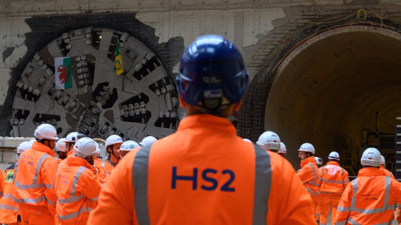 HS2 construction worker inspecting tunnel progress, showcasing infrastructure development and engineering expertise