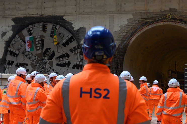 HS2 construction worker inspecting tunnel progress, showcasing infrastructure development and engineering expertise