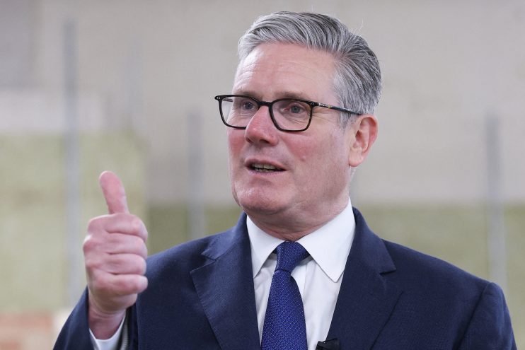 Keir Starmer stands firmly addressing media, emphasizing his decision not to resign amidst political challenges.
