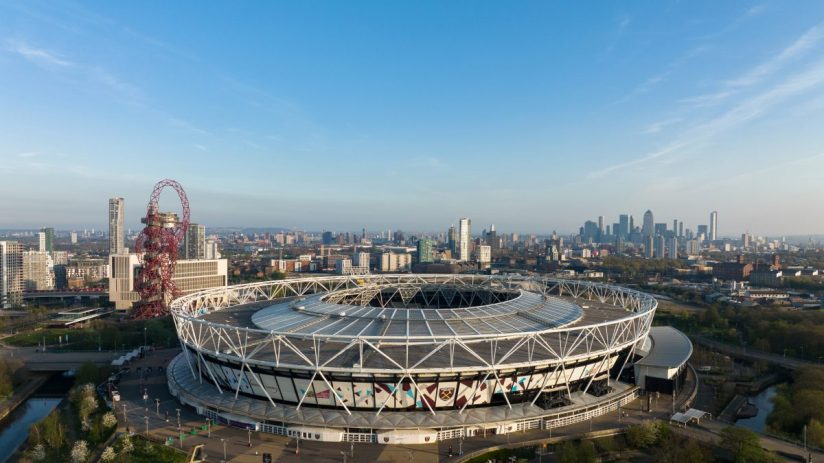 London stadium exterior showcasing modern architecture and vibrant atmosphere during a major event or sports match.