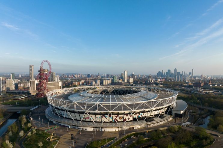 London stadium exterior showcasing modern architecture and vibrant atmosphere during a major event or sports match.