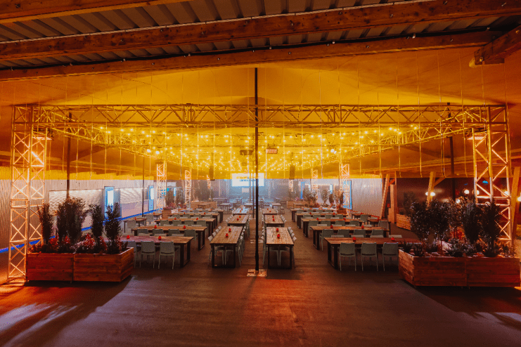 Freight Brixton rooftop bar in New London with city skyline views, modern decor, and patrons enjoying cocktails at sunset