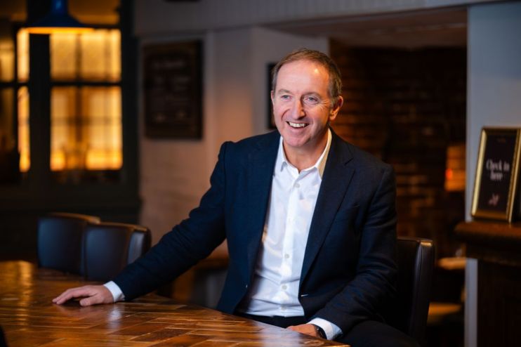 Nick Mackenzie, CEO of Greene King, in a corporate setting discussing company strategy and market trends.