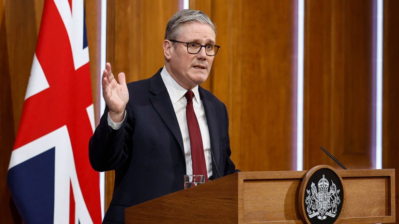 Prime Minister Keir Starmer addressing media at a press conference podium, discussing current governmental policies and in...