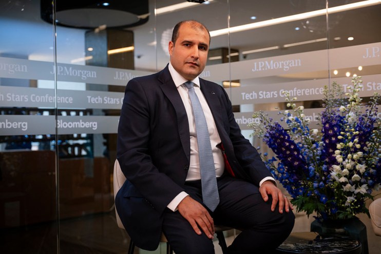 Quantexa CEO Vishal Marria speaking at a business conference, addressing data analytics and company growth strategies.